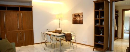 a kitchen with a table and chairs in a room at Rota Suites in Sorrento