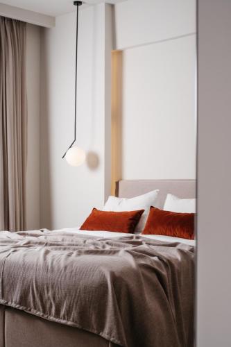 Ένα ή περισσότερα κρεβάτια σε δωμάτιο στο The City Hotel & Suites