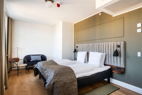 Postel nebo postele na pokoji v ubytování Hotel Sct. Thomas