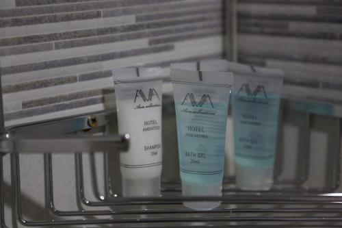 a group of four moisturizers sitting on a table at Griboedov Apartment in Tbilisi City