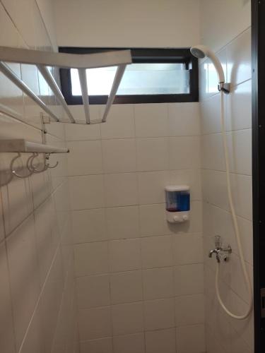 a bathroom with a shower with a window at Apartemen MAJ at Ecohome Citra Raya in Nalagati