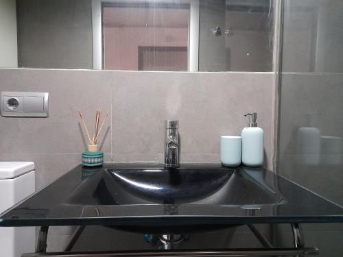 a bathroom with a sink and a mirror at CAREAGA 4 in Almería