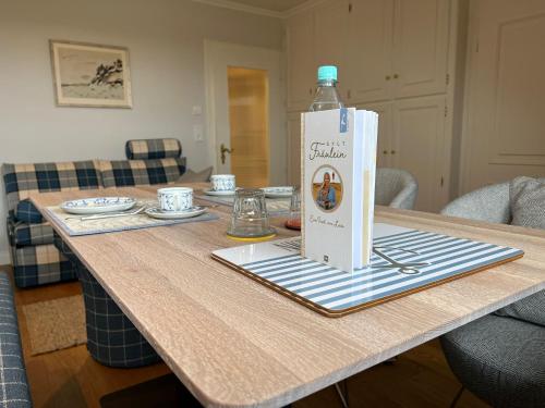 a bottle of water sitting on top of a table at Passat in Wenningstedt