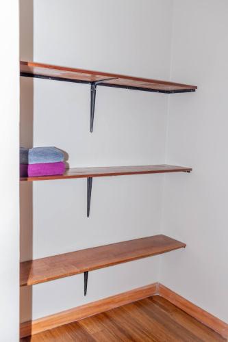 a pair of wooden shelves on a wall at Enkarsis Resort Villa in Kitengela 