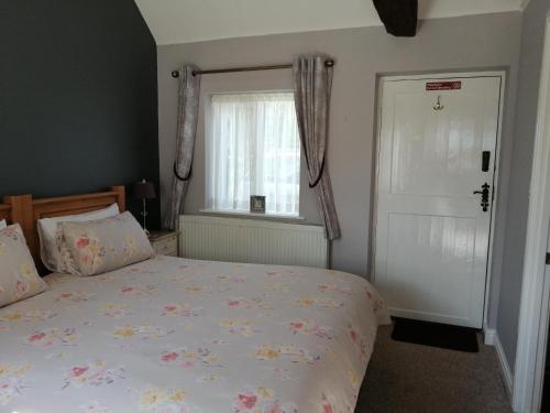 Cama o camas de una habitación en Risley Guest House