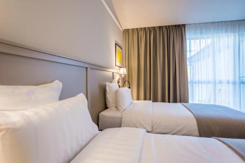 Hotel Residence Promenadeにあるベッド