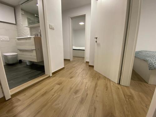 an empty room with a vanity and a bedroom at Apartma Sinitus in Izola