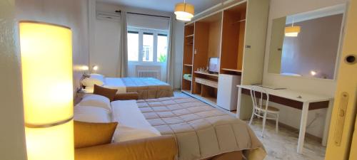 A bed or beds in a room at GIAMBATTISTA HOUSE BARI