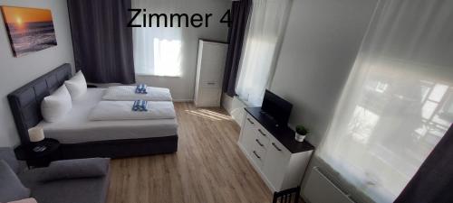 Ένα ή περισσότερα κρεβάτια σε δωμάτιο στο Altstadt Appartements
