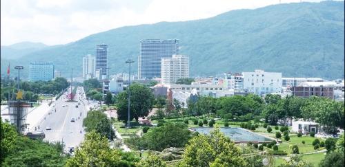 a view of a city with mountains in the background at Queen Hotel in Quy Nhon