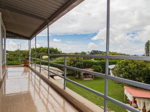 a balcony of a house with a view at Hotel Campestre Sueño del Abuelo in Pereira
