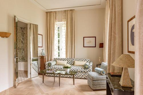a living room with a couch and a table at Saint James Paris in Paris