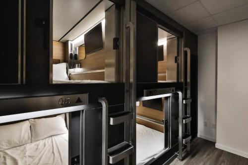 a group of bunk beds in a room at Pod Hotel in Montreal