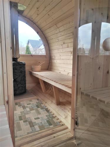 an inside view of a sauna with a window at Gościniec Echo in Piecki