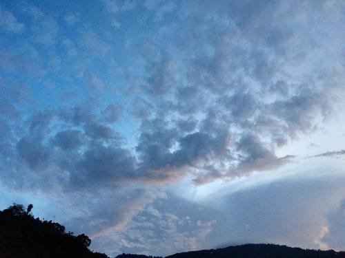 a view of a cloudy sky at sunset at Quo Vadis Farm in Māngwa