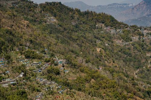 an aerial view of a village in a mountain at Quo Vadis Farm in Māngwa