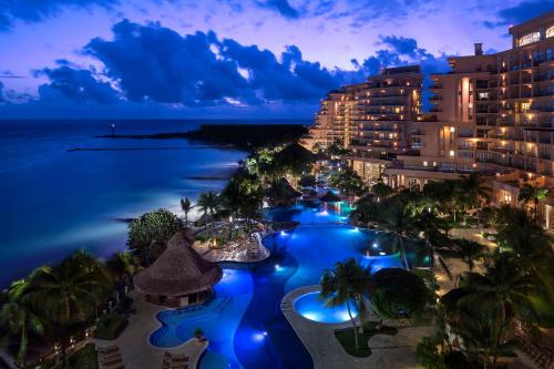 an aerial view of the resort at night at Grand Fiesta Americana Coral Beach Cancun - All Inclusive in Cancún