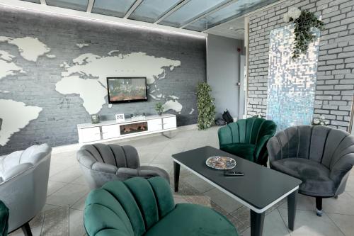 a waiting room with a map of the world on a wall at Selin Otel Belek in Antalya