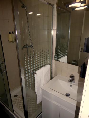a bathroom with a shower and a sink and a shower at 2Stay- A0 in Ponta Delgada