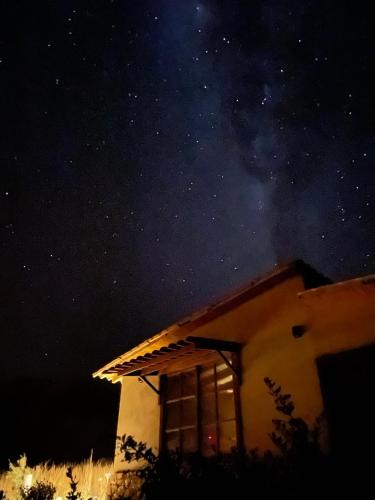 a house at night with the stars in the sky at Wayarumi Skyhotel in Carhuaz