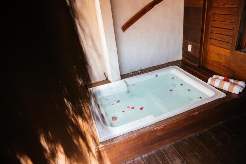 a jacuzzi tub with red balls in it at Hurricane Jeri in Jericoacoara
