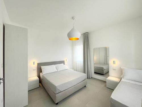 Llit o llits en una habitació de Appartamenti le Conchiglie 1