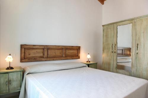 A bed or beds in a room at Dimora Da Tito - La Corte dei Colori