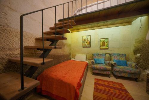 Кровать или кровати в номере Salkım Cave House