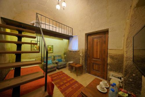 Кровать или кровати в номере Salkım Cave House