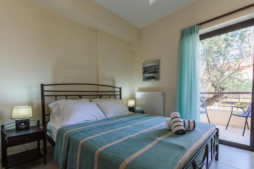 A bed or beds in a room at Armonia Studios Avia 2
