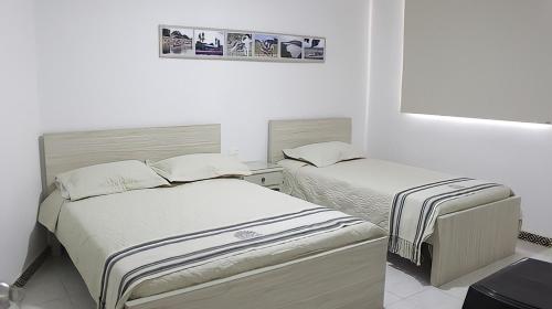 Postel nebo postele na pokoji v ubytování Hotel Iraka Zenu