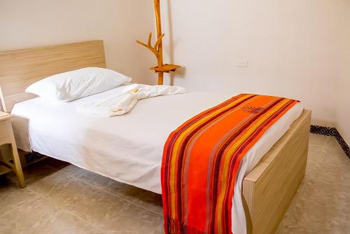 Postel nebo postele na pokoji v ubytování Hotel Iraka Zenu