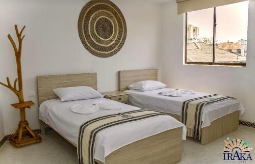 Voodi või voodid majutusasutuse Hotel Iraka Zenu toas