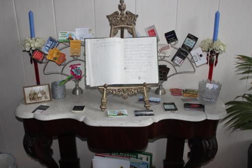 a table with a sheet music on top of it at La Demeure aux Hortensias in Pleurtuit