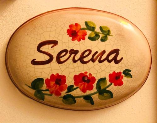 a plate with the word serrano on a wall at Mirose's holiday home in Castelbuono