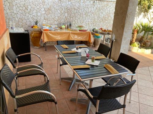 Restoranas ar kita vieta pavalgyti apgyvendinimo įstaigoje Punta Prosciutto Angel Bay B&B