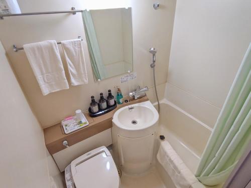 a small bathroom with a toilet and a sink at Kadoma - Hotel - Vacation STAY 42850v in Kadoma
