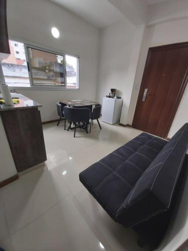 a living room with a couch and a table at Moreno Apart in San Miguel de Tucumán
