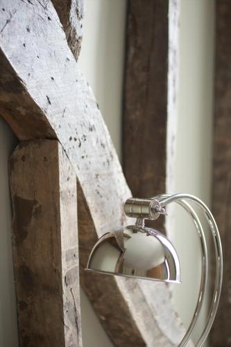 a shower head attached to a wooden door at Kings Head in Cirencester