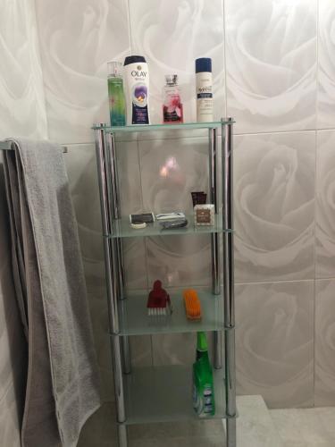 a glass shelf in a bathroom with a towel at JEANOEL Chateau Cozy 2beds 1bath apartment in San Fernando