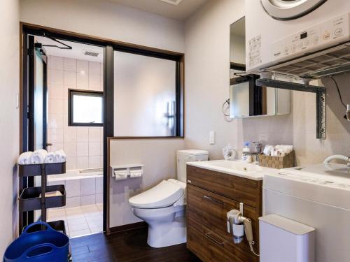 a bathroom with a toilet and a sink at Grace Villa Miyakojima - Vacation STAY 60494v in Uechi