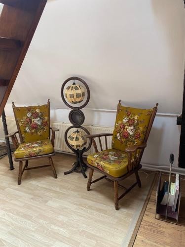 two chairs and a table in a room at SOEPP hotel & restaurant in Alkmaar