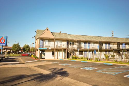 an empty parking lot in front of a hotel at Motel 6-Sacramento, CA - Central in Sacramento