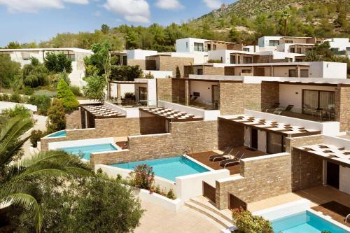 an aerial view of a villa with a swimming pool at Wyndham Loutraki Poseidon Resort in Loutraki