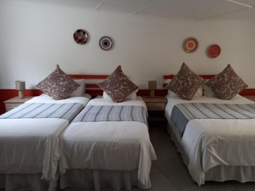 Postel nebo postele na pokoji v ubytování Ashtonville Terraces Guesthouse