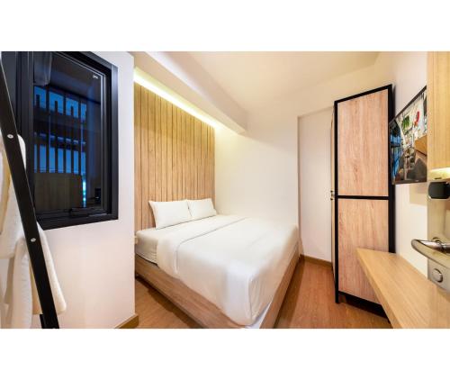 Ein Bett oder Betten in einem Zimmer der Unterkunft Siam Subway Hostel and Café