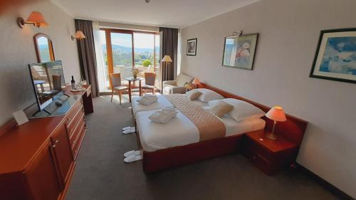 Posteľ alebo postele v izbe v ubytovaní Rosengarten Hotel & Restaurant