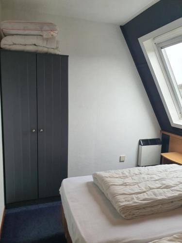 Postel nebo postele na pokoji v ubytování Borndiep Amelander Kaap 34