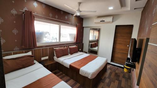 Una cama o camas en una habitación de Hotel Nova Prime