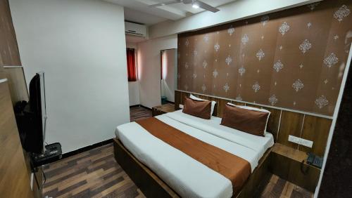 Postel nebo postele na pokoji v ubytování Hotel Nova Prime